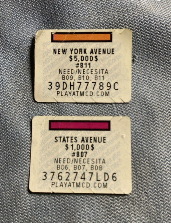 Two McDonald's Monopoly game pieces: an orange New York Avenue piece worth $5,000 (needs the set B09, B10, B11) and a magenta States Avenue piece worth $1,000 (needs B06, B07, B08). Both are common properties.